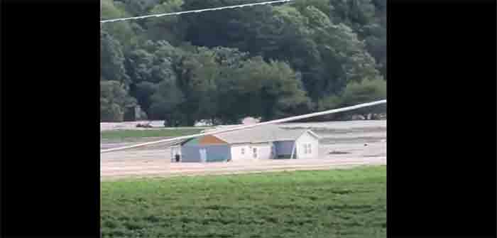 Hurricane_Helene_Newport_TN_Man_on_Porch_Floating_Down_River