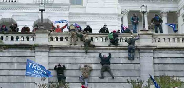 Protesters_Scaling_Capitol_Wall_January_6_2020