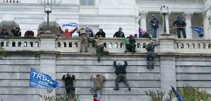 Protesters_Scaling_Capitol_Wall_January_6_2020