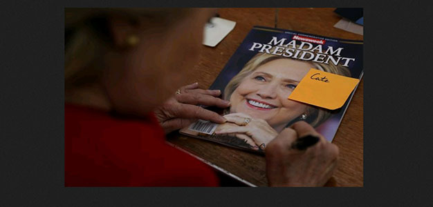 screenshot_hillary_clinton_signing_copyof_newsweek_madam_president