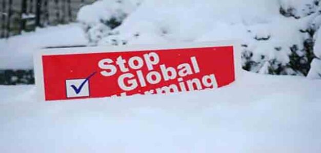 Stop_global_warming_sign_under_tons_of_snow