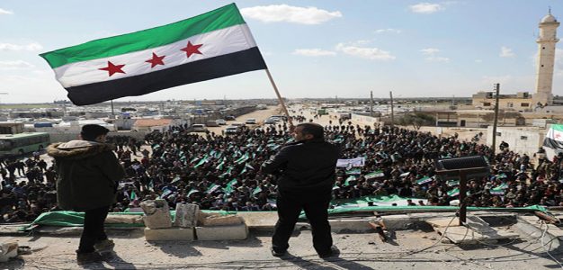 Syrian_Holds_Opposition_Flag_Azaz_and-Killis_Reuters