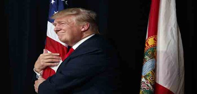Trump_Hugging_American_Flag_AP_Evan_Vucci