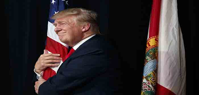 Trump_Hugging_American_Flag_AP_Evan_Vucci