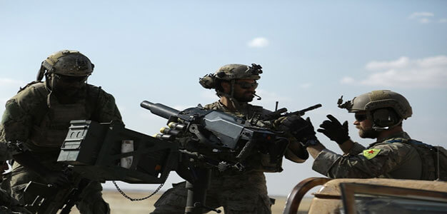 US_soldier_and_YPG_fighter_in_Fatisah_Raqqa-province_Syria_AFP