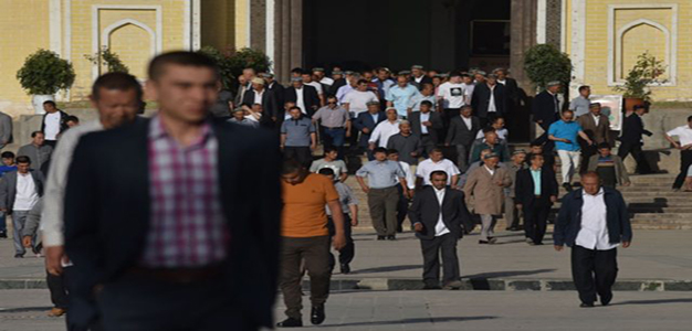 Uighur_men_leave_after_Eid_al_Fitr_AFP_GettyImages_Greg_Baker